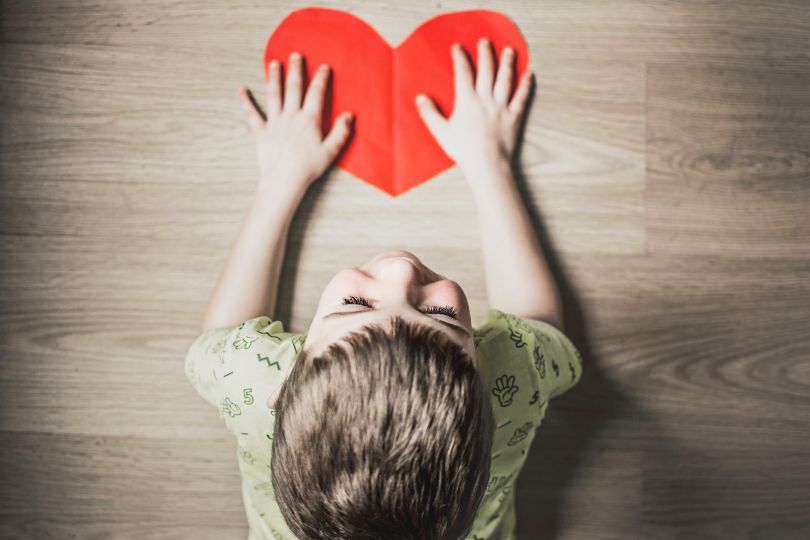 Kid with a paper heart